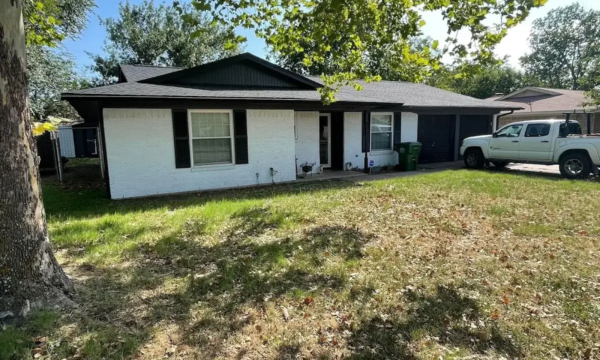 Professional roofing crew working on a residential roof in Oxon Hill